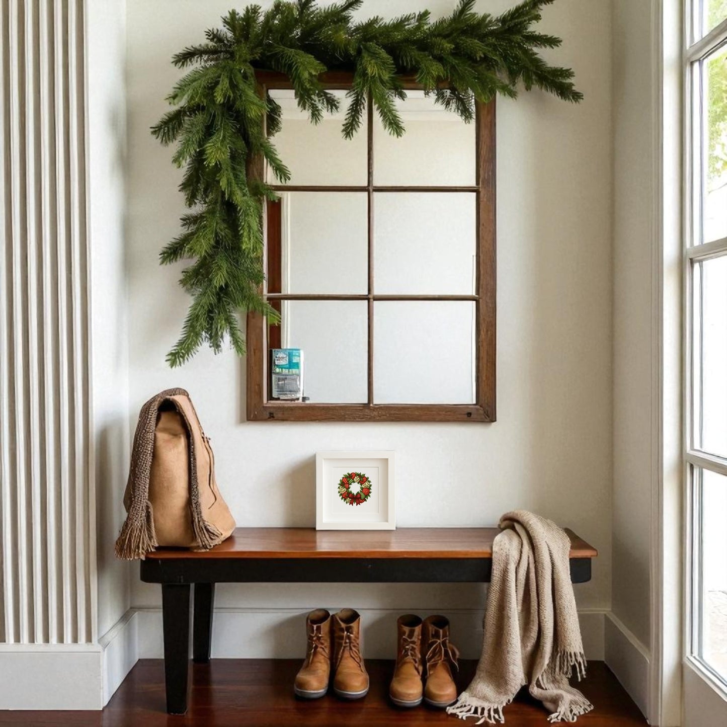 A wooden bench holds brown boots, a tan bag, and a beige scarf. Above, the Mirabilia Boutique Patchwork Christmas Wreath Sign adds festive charm and natural light creates a cozy, seasonal entryway scene.