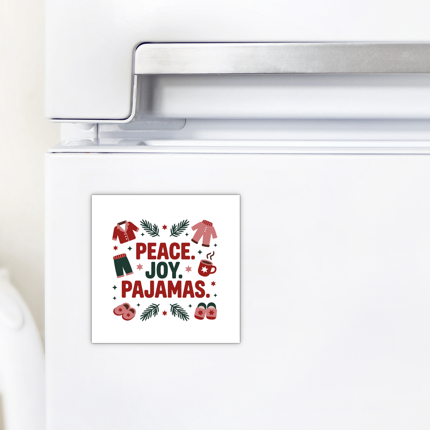 The Peace Joy Pajamas Magnet by Mirabilia Boutique features festive sweaters, socks, and pine branches in red, green, and pink—perfect holiday fridge decor or a charming gift.