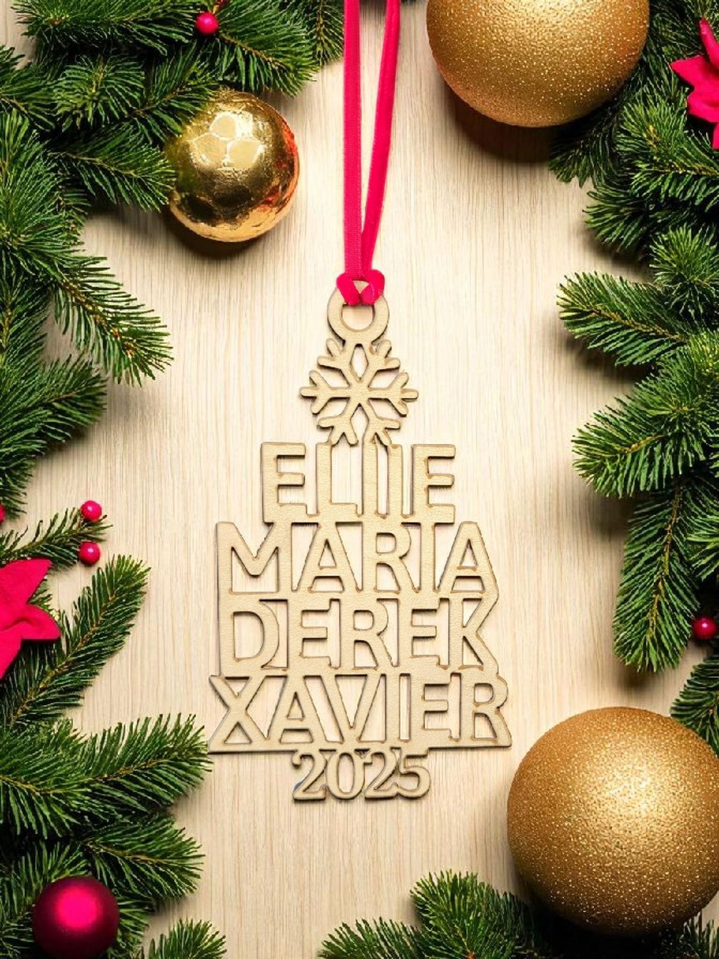The Custom Family Christmas Ornament With Year by Mirabilia Boutique features “Ellie, Maria, Derek, Xavier” and “2025” on a tree shape with a red ribbon—an ideal personalized family keepsake for your holiday décor.