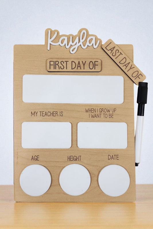 The Mirabilia Boutique Reusable School Board | First & Last Day of School Sign features sections for "First/Last Day of," "My Teacher Is," "Age," and more, with marker included—ideal for capturing your child's school milestones.