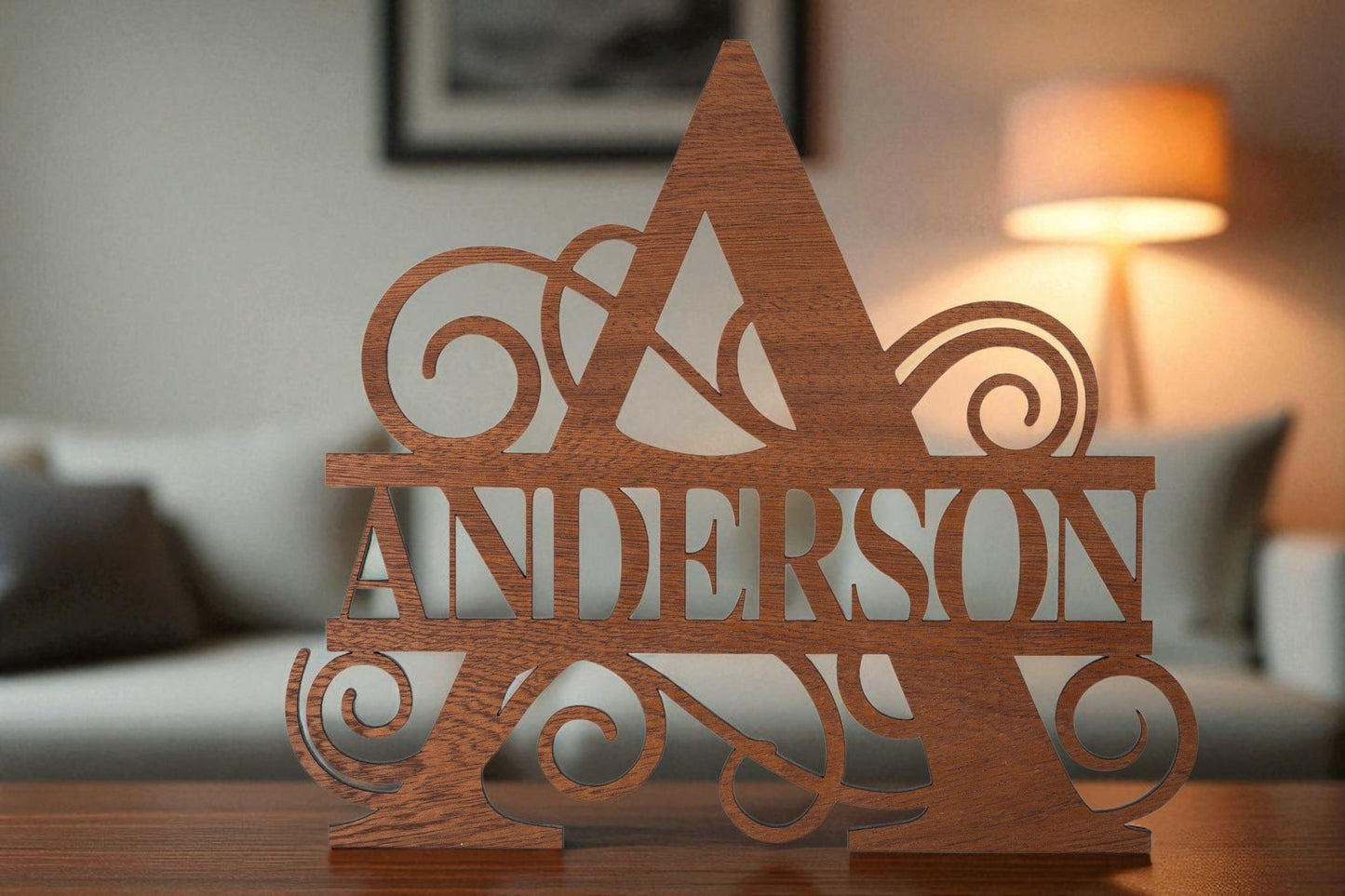 The Custom Walnut Name Cutout by Mirabilia Boutique, featuring a bold initial and your family name, adds personalized charm to any living room as an elegant decor gift.