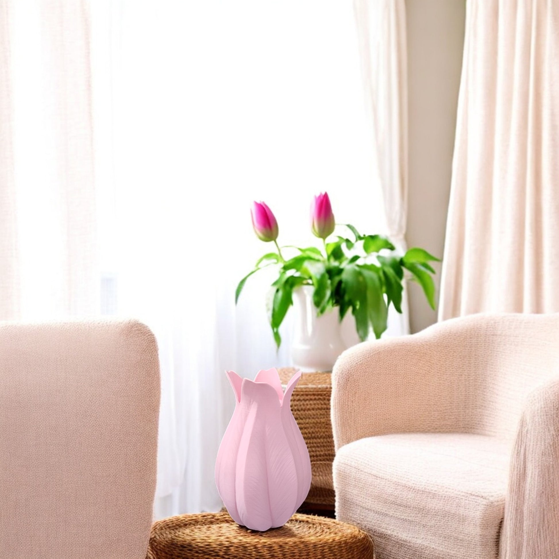 A cozy living room with two beige armchairs, a wicker side table, and the Mirabilia Boutique Pink Tulip Vase—Decorative Accent for Easter & Mother’s Day—brightening the window with sheer curtains.