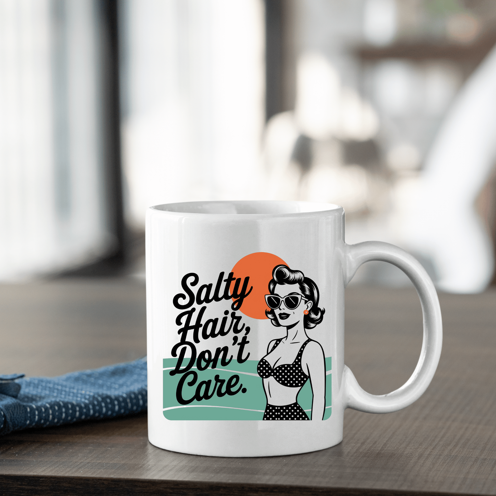 The Salty Hair Don’t Care Mug – Retro Beach Babe Vibes by Mirabilia Boutique features a woman in sunglasses and a polka dot swimsuit with coastal graphics, making it the perfect mug for your beachy coffee moments.
