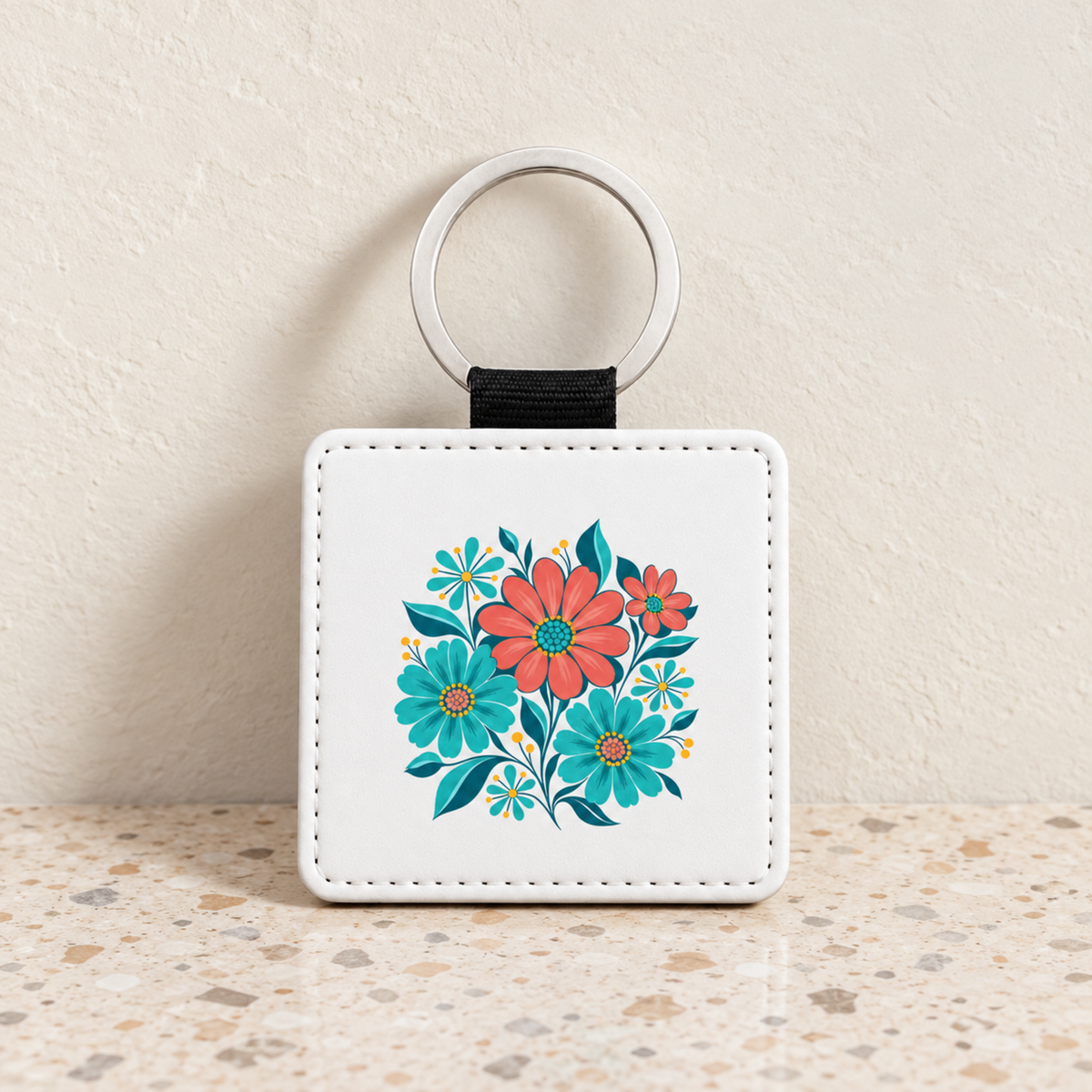 Square Poolside Petals Floral Keychain | Chrome & Starlight featuring a coral and teal floral illustration on a white background.