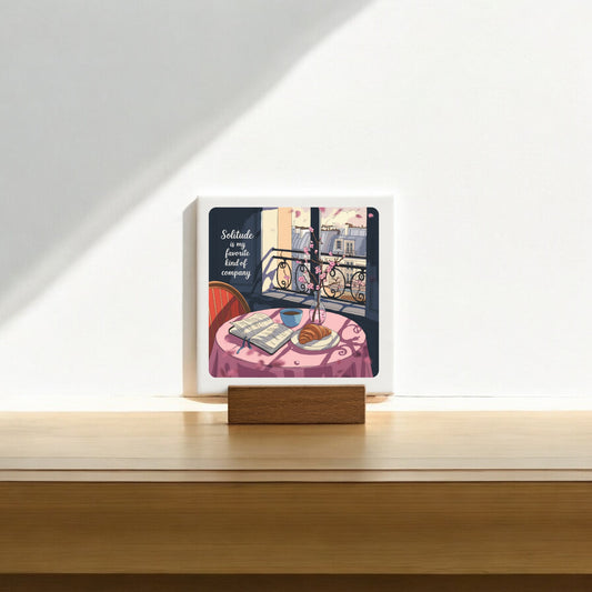 The Solitude Mini Sign – Parisian Morning Still Life by Mirabilia Boutique features a cozy table scene and the quote, "Solitude is a fine, lovely, beautiful company"—a thoughtful gift for introverts.
