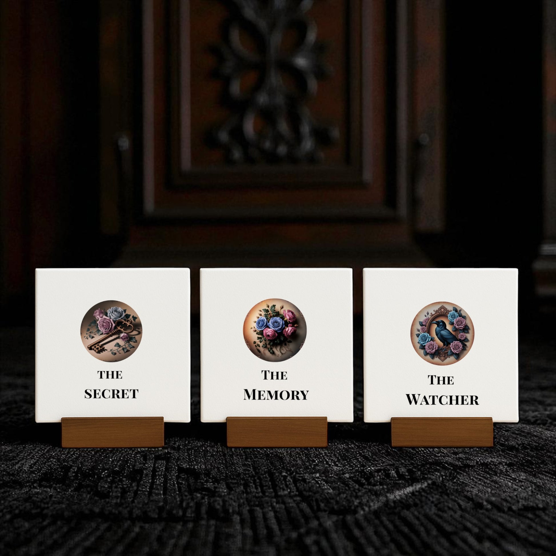 The Dead Regency Mini Sign Set by Mirabilia Boutique features three gothic signs—Raven, Roses & Keys—displayed on wooden stands against a dark, ornate backdrop, perfect for gothic home decor or dark academia spaces.