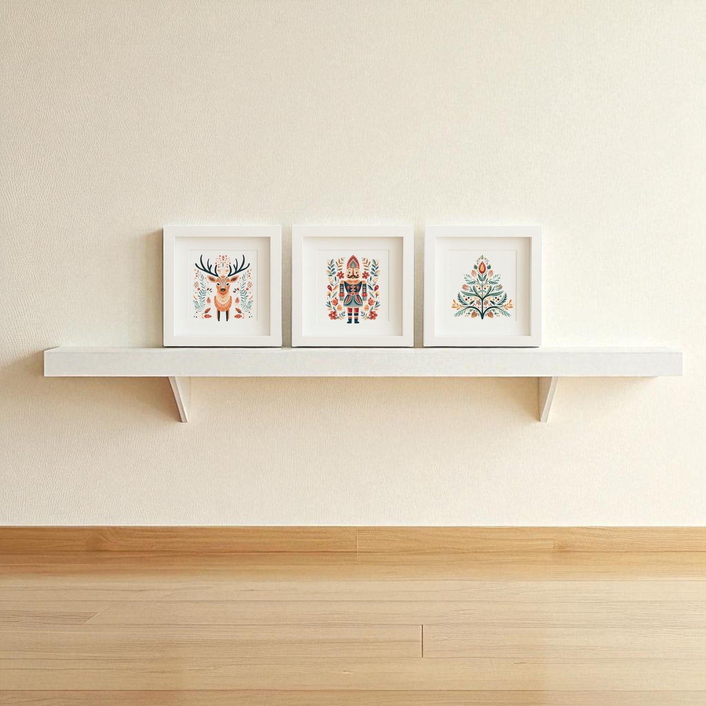The Reindeer Nutcracker Tree Shadowbox Trio by Mirabilia Boutique brings Scandinavian holiday charm to your space, with three framed illustrations as festive wall art above a light wood floor and beige wall.