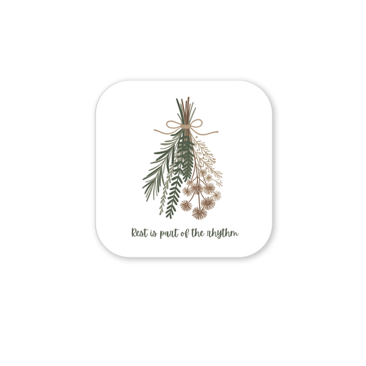 The Botanical Magnet | Rest Reminder by Mirabilia Boutique features assorted green and brown sprigs tied with string on a rounded square white background with the text "Rest is part of the rhythm." A calming fridge decor for slow living.