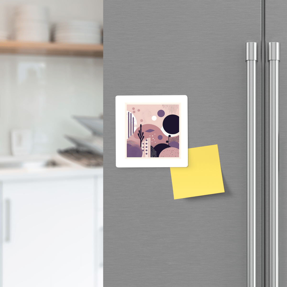 A refrigerator door displays the Mirabilia Boutique "Purple Dusk Mid Century Modern Magnet" and a blank yellow sticky note. In the background, white kitchen shelves and dishes can be seen.