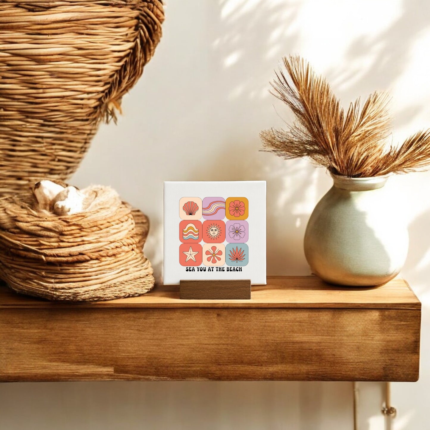 The Sea You at the Beach Mini Canvas – Coastal Summer Vibes by Mirabilia Boutique features colorful beach icons and text, making it a perfect coastal decor accent or beach house gift. Display it on a shelf to add seaside charm to your space.