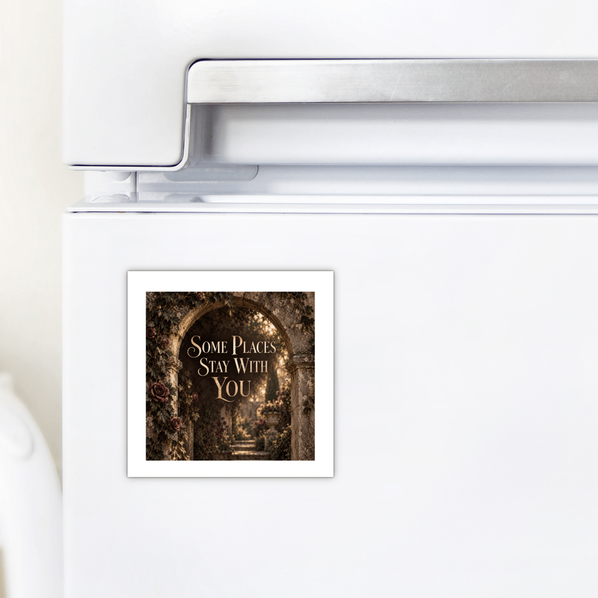 Brighten up your kitchen with the “Some Places Stay With You Magnet | Velvet Ruins” from Mirabilia Boutique. This decorative magnet features an archway draped in flowers and the heartfelt phrase “Some places stay with you,” making it a charming and thoughtful gift for any home.