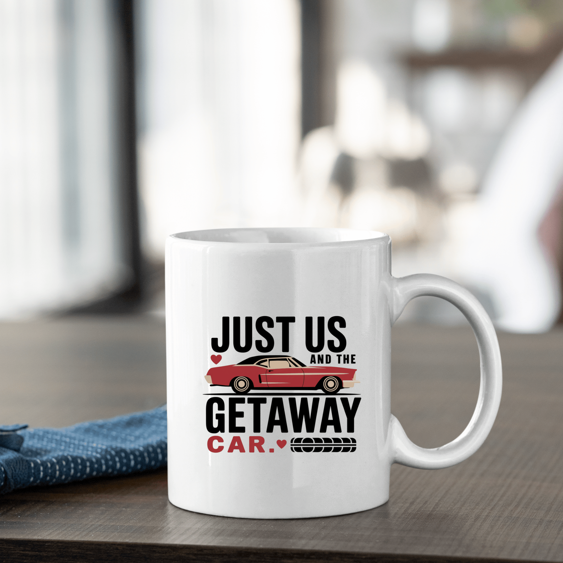 The Romantic Getaway Car Mug by Mirabilia Boutique features “Just us and the getaway car” beside a red car and tire mark, making it a charming, funny couples gift and perfect for romantic moments.