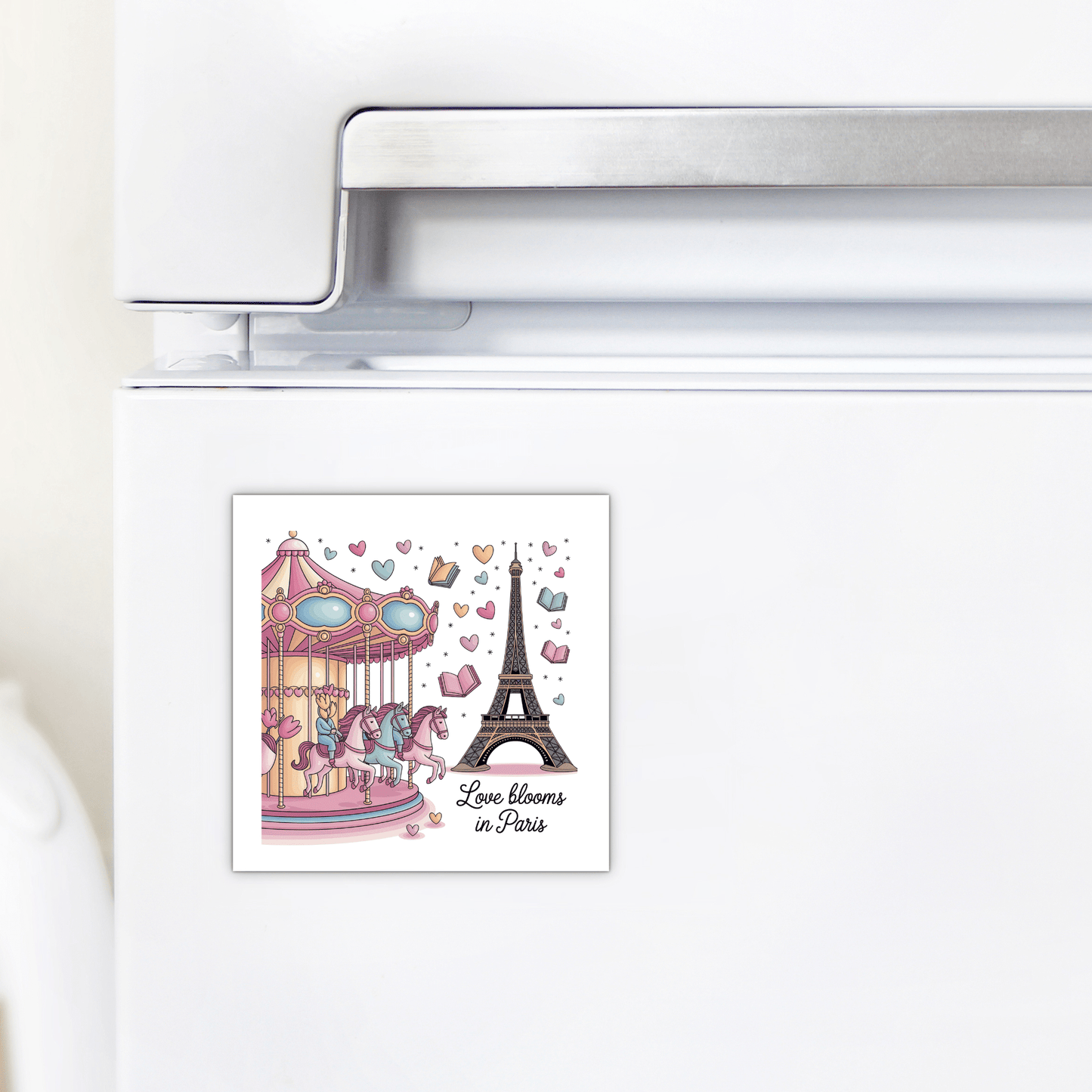 The Love Blooms in Paris Magnet – Whimsy & Romance by Mirabilia Boutique features a whimsical carousel, Eiffel Tower, and pastel accents—adding a charming touch of Parisian flair to your fridge.