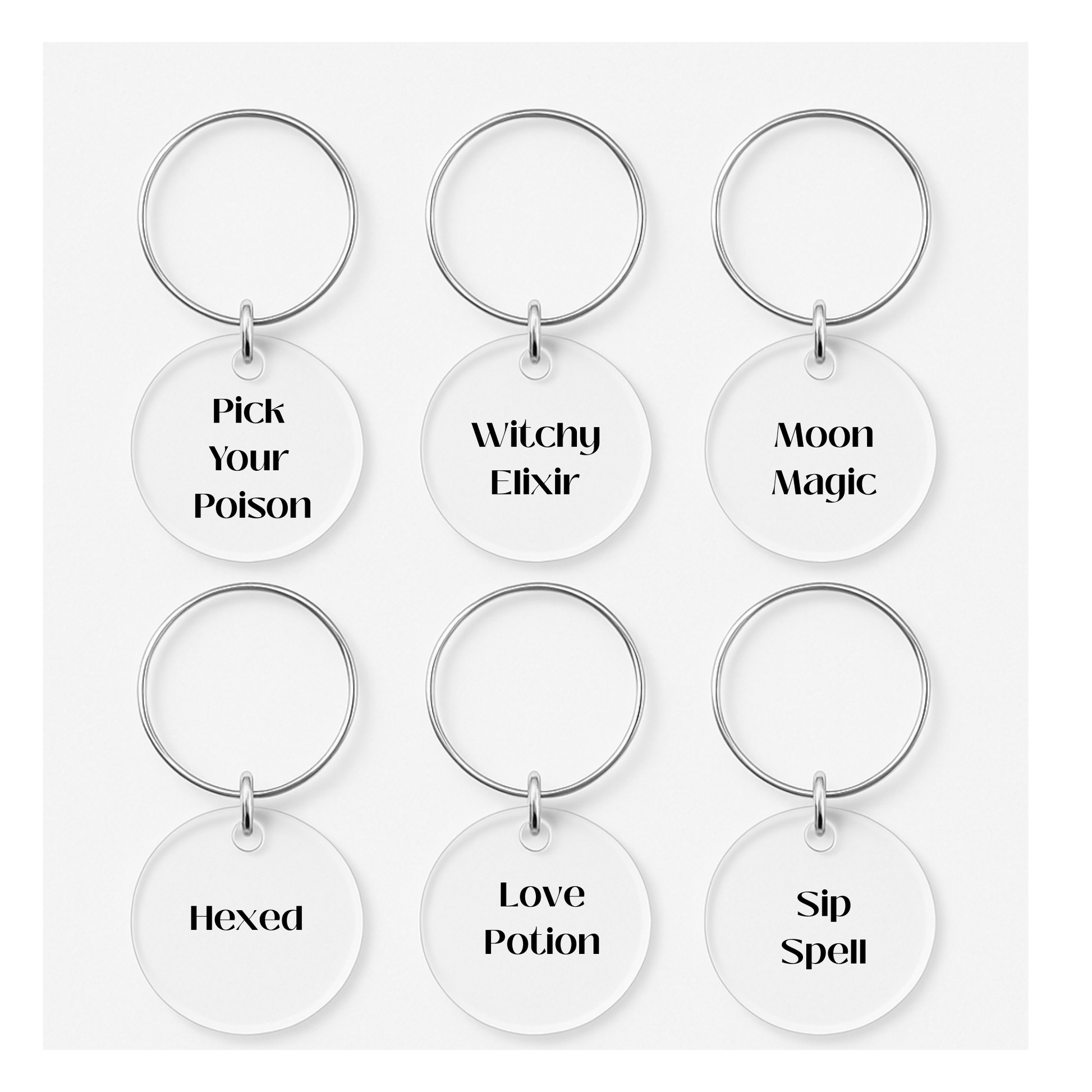 The Salem Soirée Halloween Cocktail Kit by Mirabilia Boutique includes six witchy wine charms with phrases like "Pick Your Poison," plus recipes and a sign—perfect for your next spooky cocktail night.