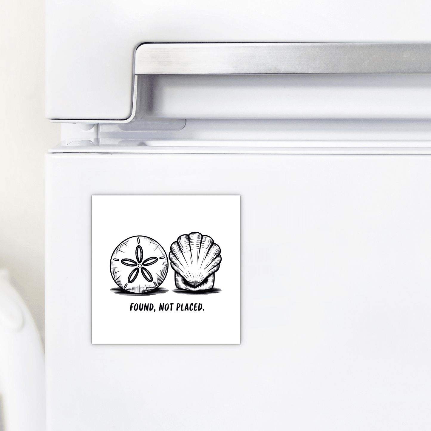 The Found, Not Placed Magnet – Minimalist Coastal Quote by Mirabilia Boutique features hand-drawn sand dollar and seashell art with the phrase "FOUND, NOT PLACED."—a stylish square magnet for beach-inspired decor.