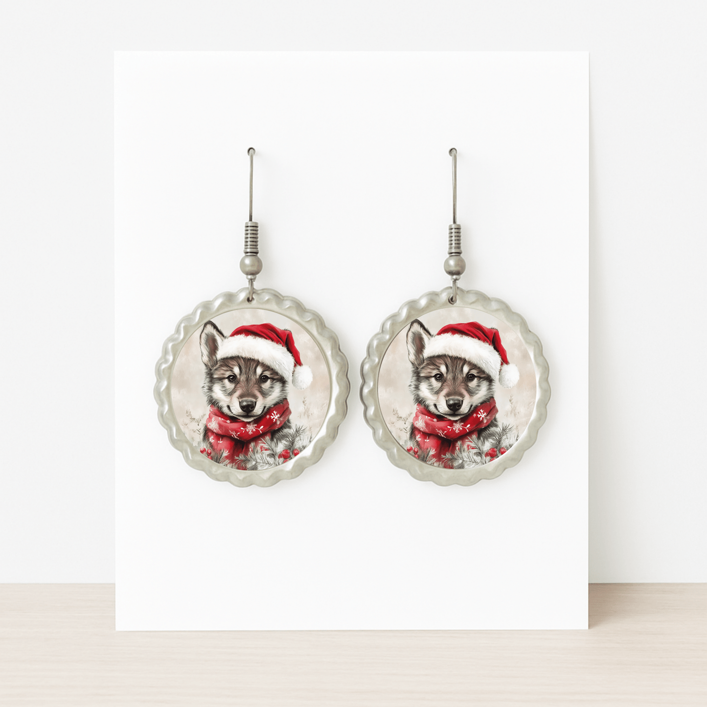 Mirabilia Boutique’s Santa Wolf Earrings are round woodland Christmas jewelry featuring a wolf pup in a Santa hat and scarf—perfect hypoallergenic holiday accessories for festive celebrations.