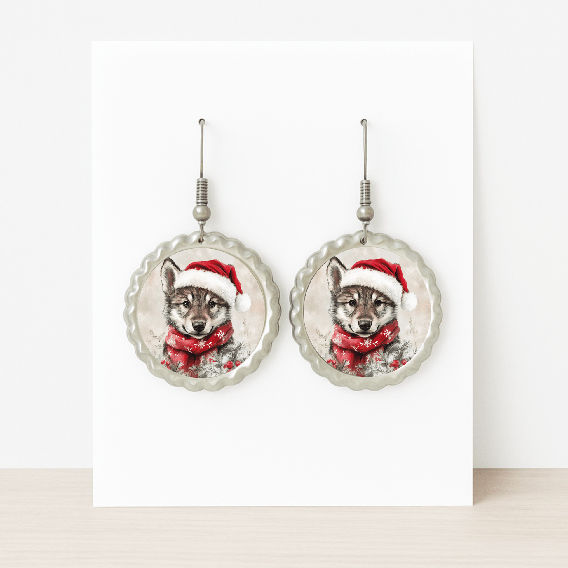 Mirabilia Boutique’s Santa Wolf Earrings are round woodland Christmas jewelry featuring a wolf pup in a Santa hat and scarf—perfect hypoallergenic holiday accessories for festive celebrations.