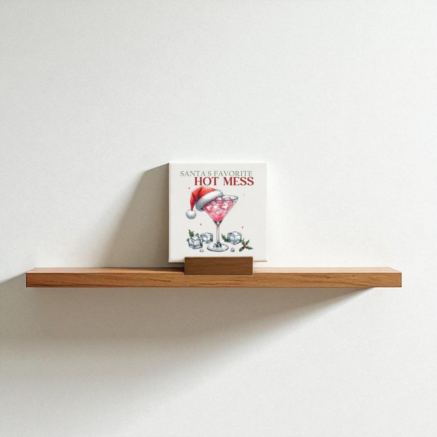 The Santa’s Favorite Hot Mess Mini Sign by Mirabilia Boutique features a festive cocktail glass with a Santa hat, making it the perfect funny holiday decor or playful Christmas bar gift.