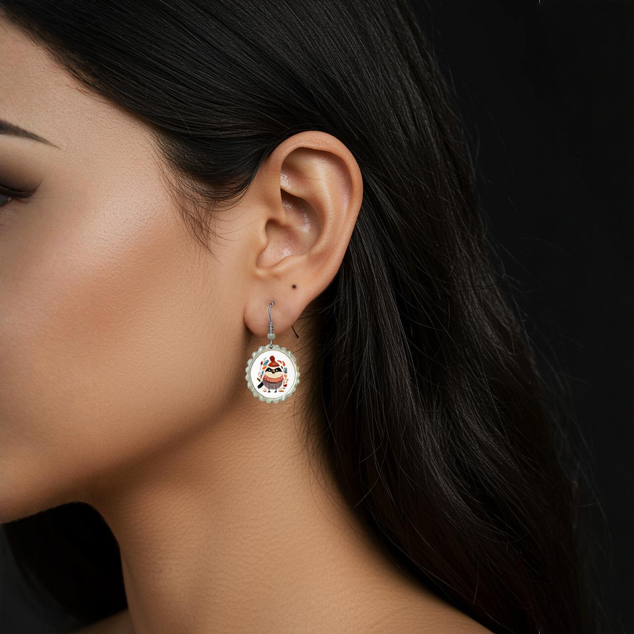 A woman with long dark hair is shown in profile against a black background, wearing Mirabilia Boutique’s Scandi Christmas Bird Earrings | Hygge Holiday Jewelry.