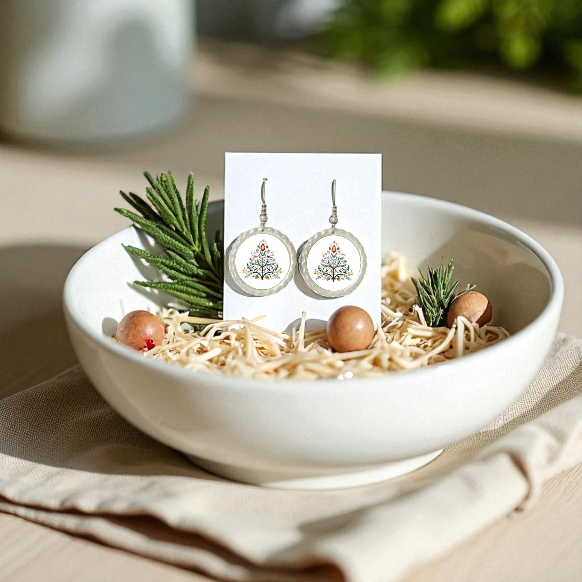 Mirabilia Boutique’s Scandi Christmas Tree Earrings, inspired by Nordic holiday style, feature colorful floral patterns and come displayed on a card with festive accents—perfect for brightening up your seasonal looks.