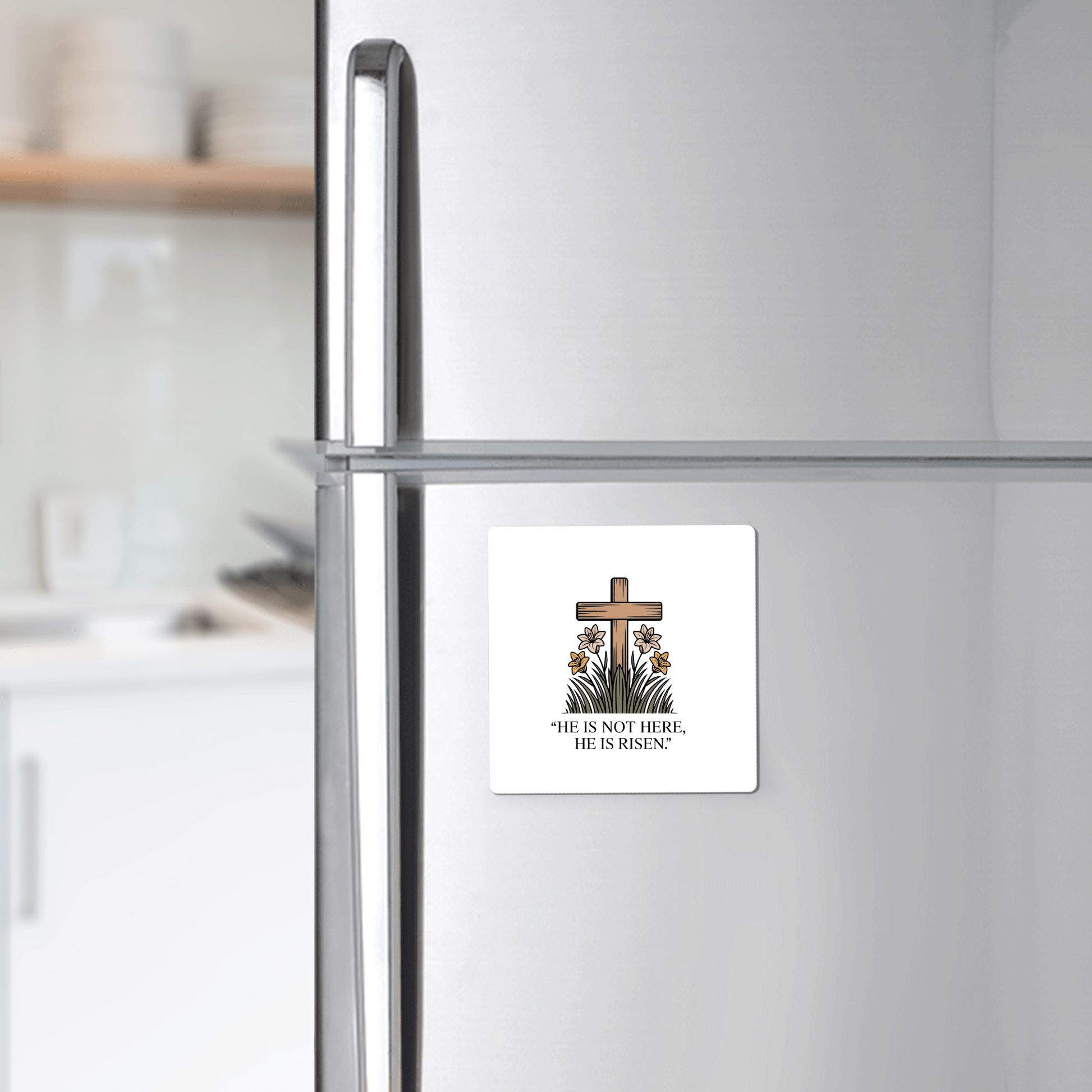 Decorate your fridge with the Mirabilia Boutique He Is Risen Easter Magnet—featuring a wooden cross, lilies, greenery, and “HE IS NOT HERE, HE IS RISEN.” A perfect faith-inspired gift for Easter.