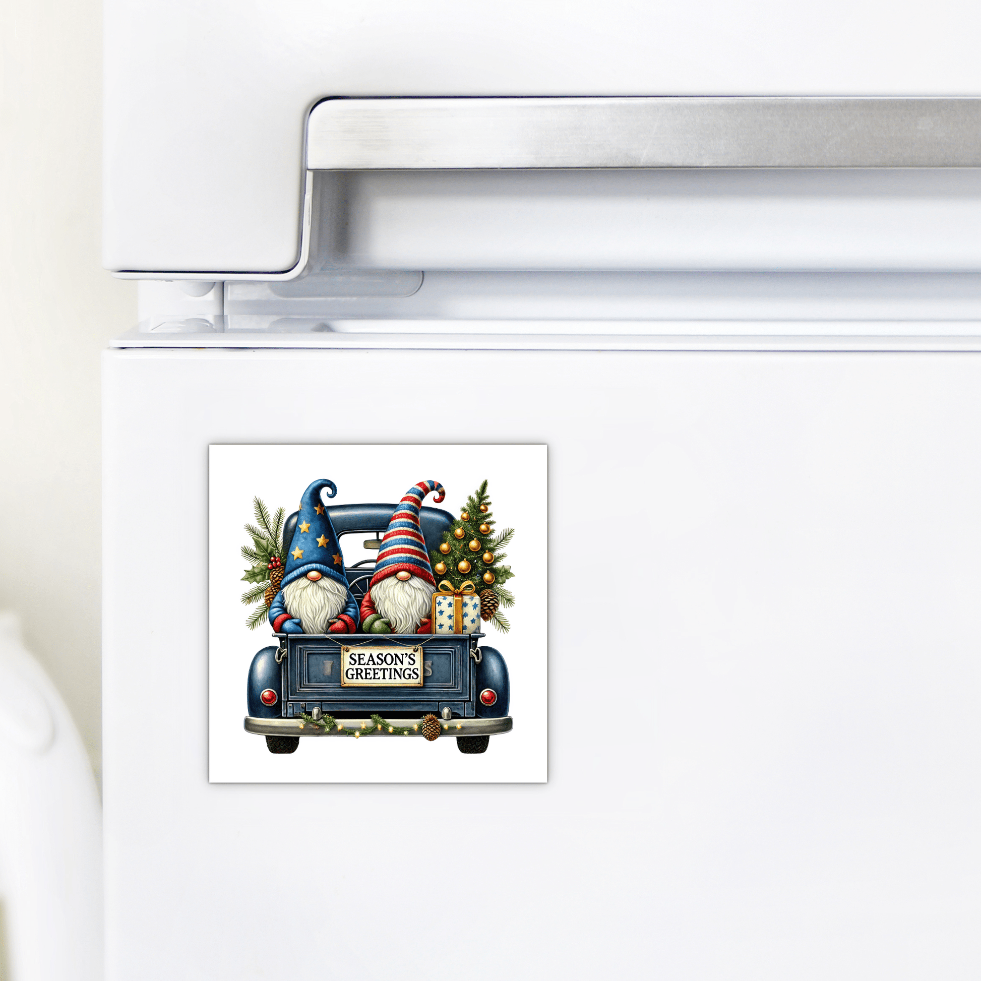 Add holiday cheer with the Mirabilia Boutique Season’s Greetings Gnome Magnet, featuring two gnomes in striped hats riding a vintage blue truck filled with gifts and trees, plus a festive "Season’s Greetings" sign.