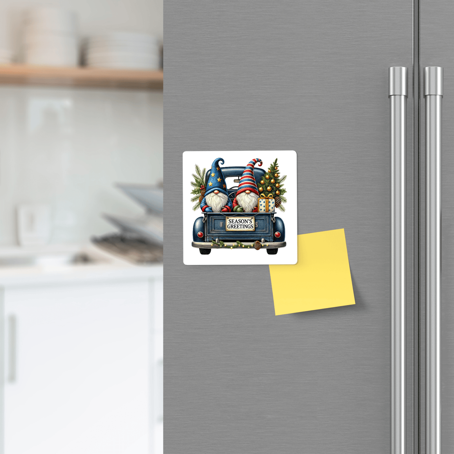 Add festive cheer to your kitchen with the Season’s Greetings Gnome Magnet | Blue Truck Holiday Decor by Mirabilia Boutique, featuring gifts on a vintage blue truck and a blank yellow sticky note for reminders.
