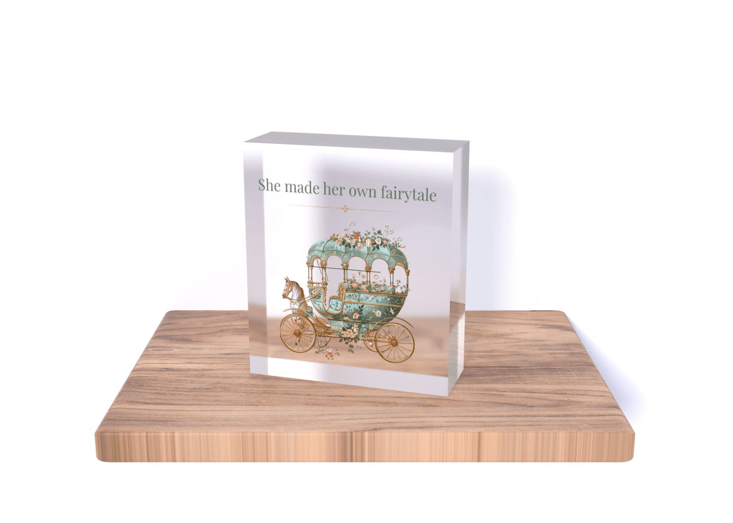 The "She Made Her Own Fairytale" Acrylic Quote Block by Mirabilia Boutique features a decorative carriage and empowering phrase on a light wood base, making it the perfect inspirational gift. Available in 3x3 or 4x4 sizes.