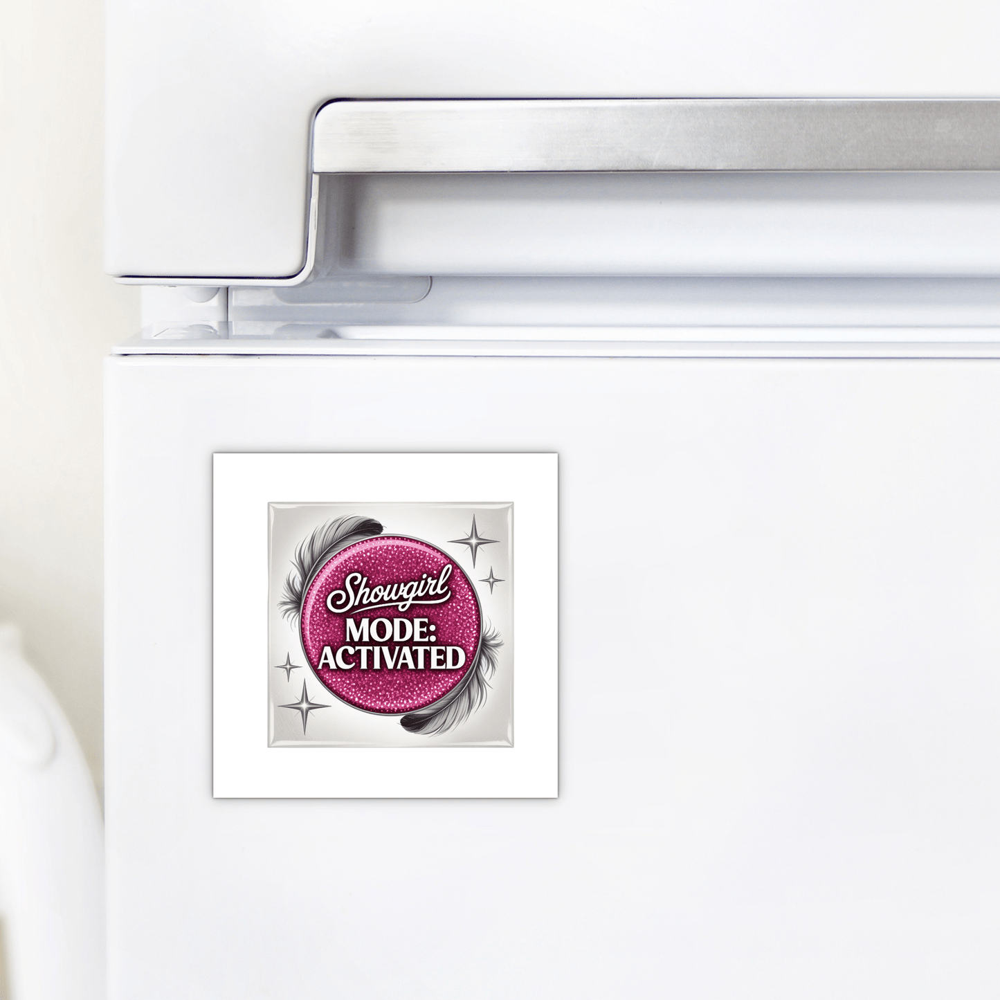A fridge door displays the Mirabilia Boutique "Showgirl Mode Activated" magnet—glam pink decor with sparkling accents and silver stars, adding confidence and glamour to your kitchen.
