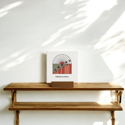 The Softness Is a Force Mini Canvas Sign by Mirabilia Boutique features a sun, mountains, and palm trees with the phrase “Softness is a force”—the perfect motivational desk decor for an inspiring, minimalist space.