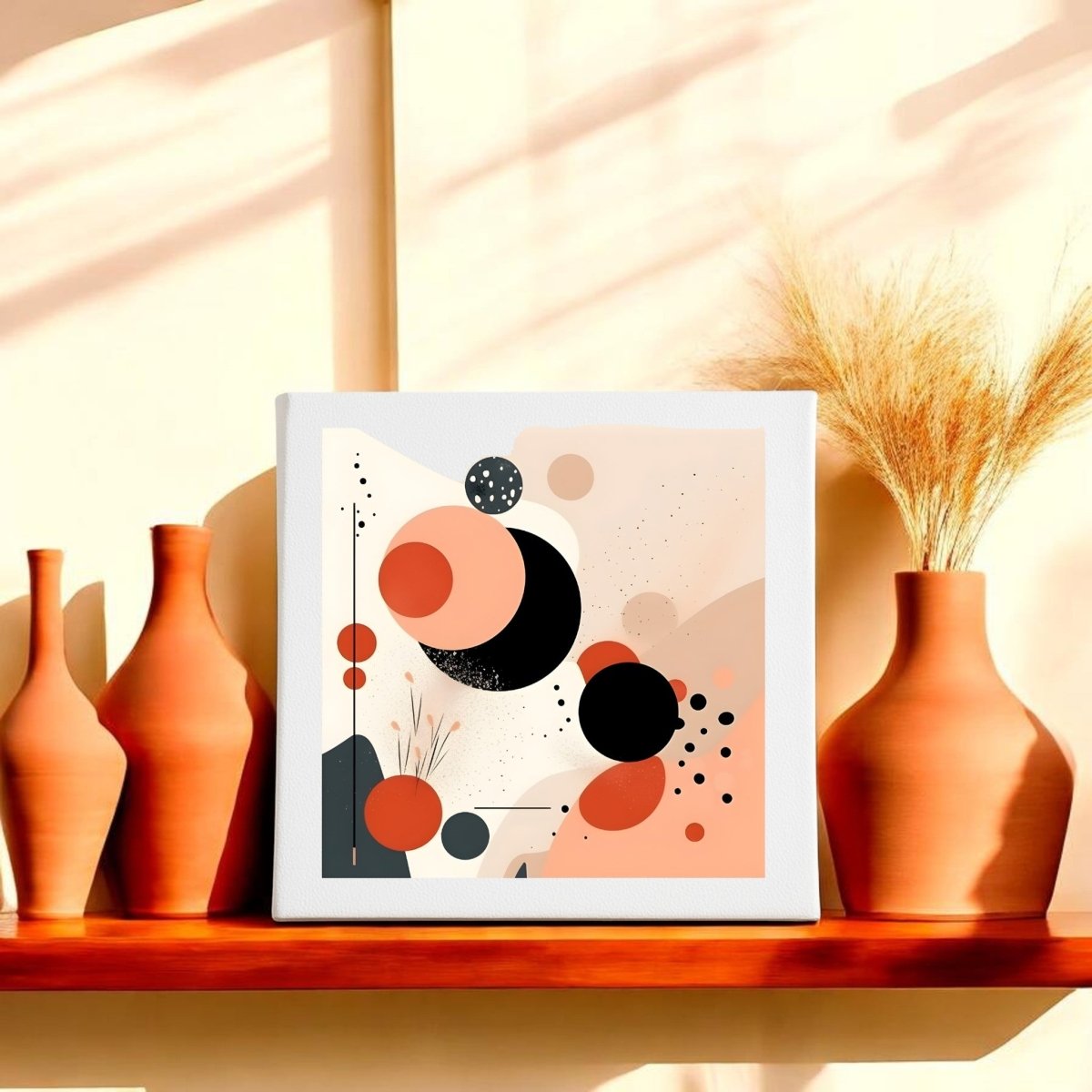 A minimalist shelf displays terracotta vases with dried wheat beside the Solar Bloom Mid Century Modern Canvas by Mirabilia Boutique, an abstract wall art with black, peach, and orange circles in warm sunlight and soft shadows.