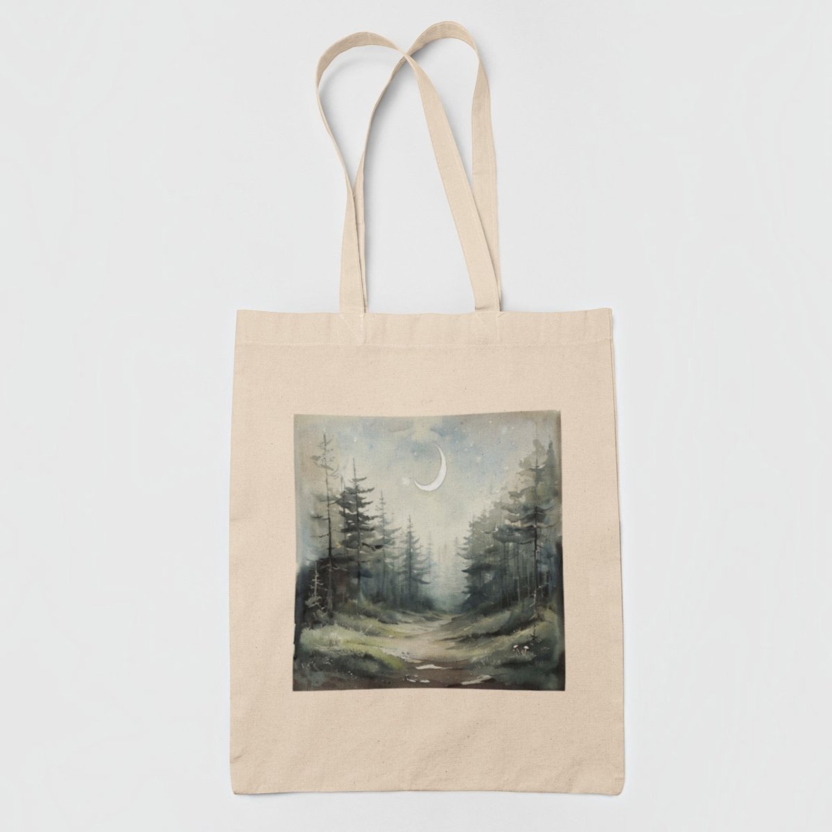 Introducing the "Some Paths Are Meant to Be Wandered Tote Bag" by Mirabilia Boutique—a beige cottagecore tote bag adorned with a dreamy watercolor painting of a misty forest path winding beneath a crescent moon, framed by tall pine trees and an enchanting night sky.