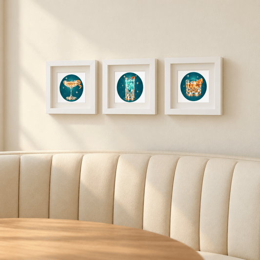 Three “An Evening at the Stardust | Mirabilia Relics” framed prints by Mirabilia Boutique hang above a curved cream booth and wooden table in a cozy, elegant space.
