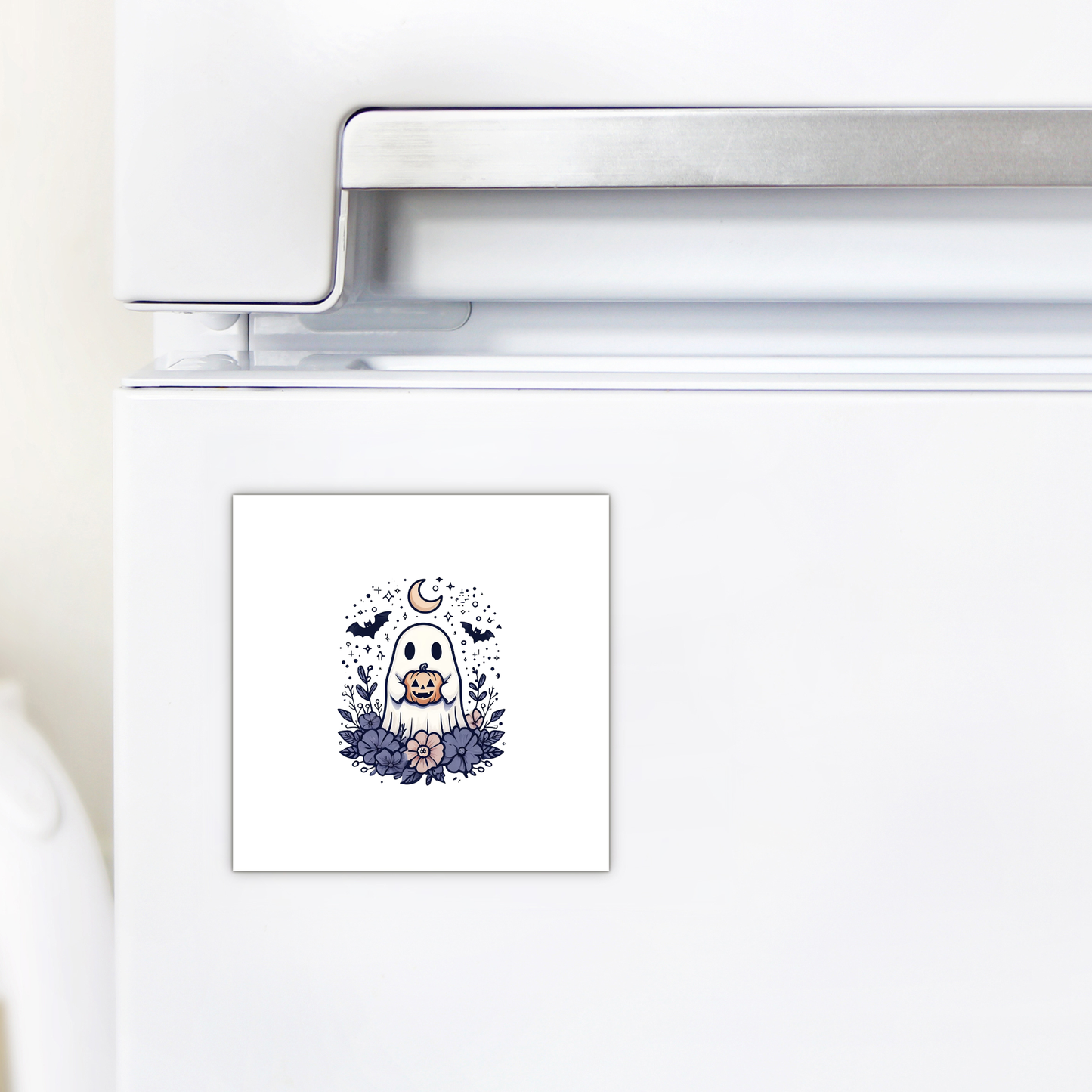 A magnet from Mirabilia Boutique's "Cute Ghost Pumpkin Magnet | Whimsical Halloween Decor" collection features an adorable dog dressed as a ghost, surrounded by autumn leaves with a crescent moon and bats in the background—making it the perfect seasonal decoration for your refrigerator.