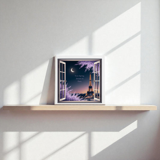 The Spring Dreams in Paris Canvas – Moonlit Eiffel Tower Art by Mirabilia Boutique features an 8x8 framed artwork on a minimalist wooden shelf, showing the Eiffel Tower at night with blossoming trees and a crescent moon.