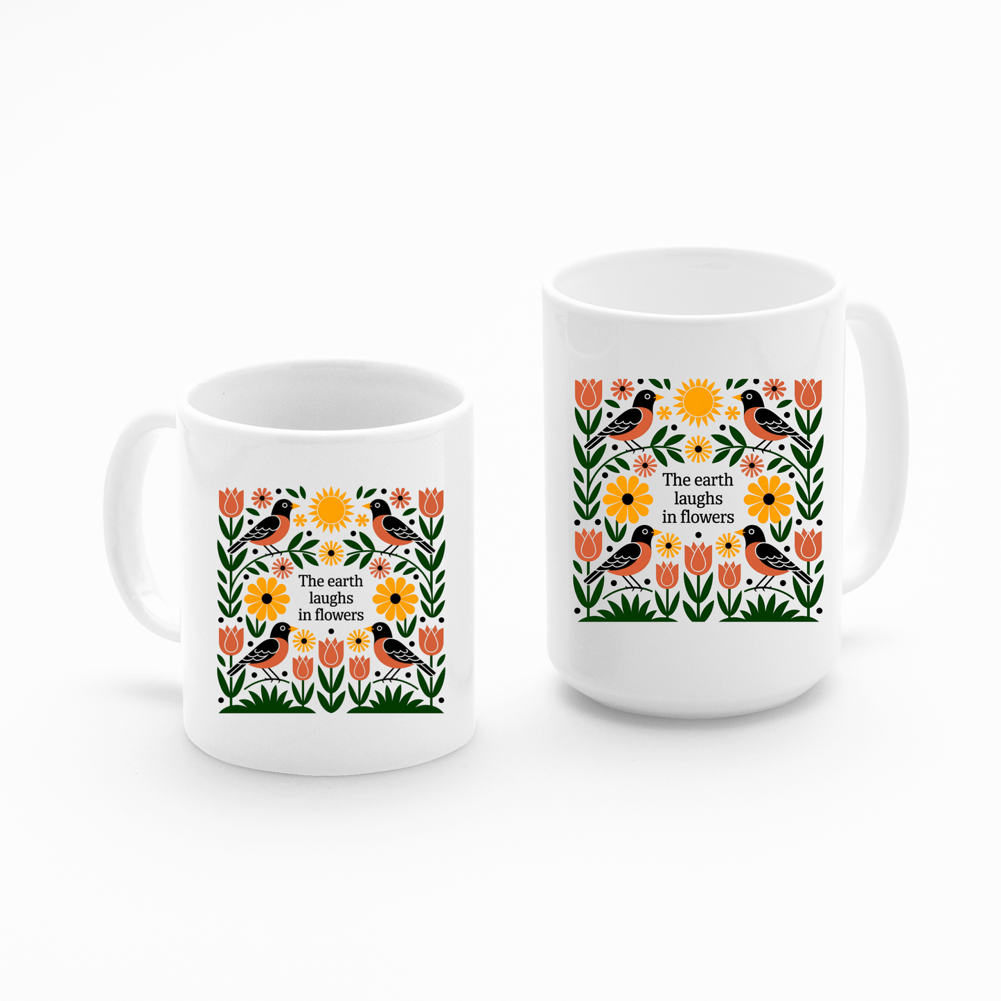 Set of two Mirabilia Boutique “The Earth Laughs in Flowers” Spring Mugs. White ceramic mugs feature colorful tulips, sunflowers, greenery, birds, and the quote—perfect for nature lovers.