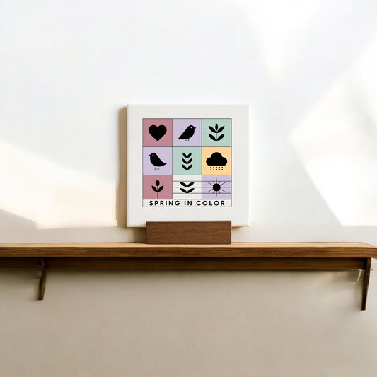 The Spring in Color Mini Canvas Sign with Wood Base by Mirabilia Boutique features cheerful spring icons and "SPRING IN COLOR" text—perfect décor to brighten your space.