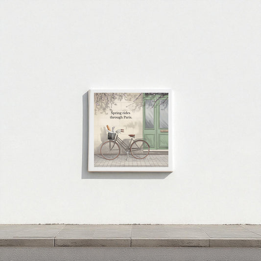 Mirabilia Boutique's "Spring Rides Through Paris Canvas Art" features a vintage bicycle by a green door, minimalist Paris scene, and the phrase “Spring rides through Paris”—ideal spring wall decor for any space.