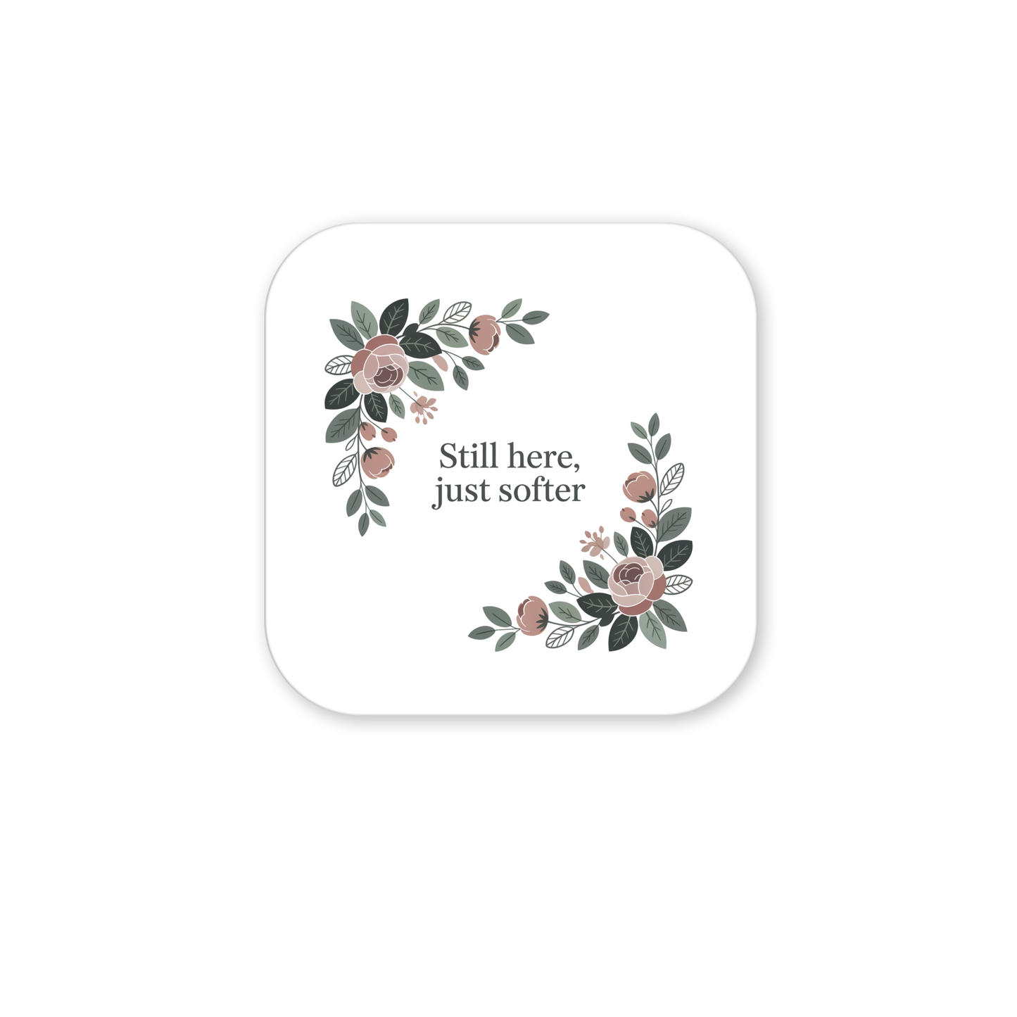The Still Here Just Softer Floral Magnet by Mirabilia Boutique features “Still here, just softer” on a white square with rounded corners, accented by watercolor-style pink flowers and green leaves—a delicate, uplifting gift.