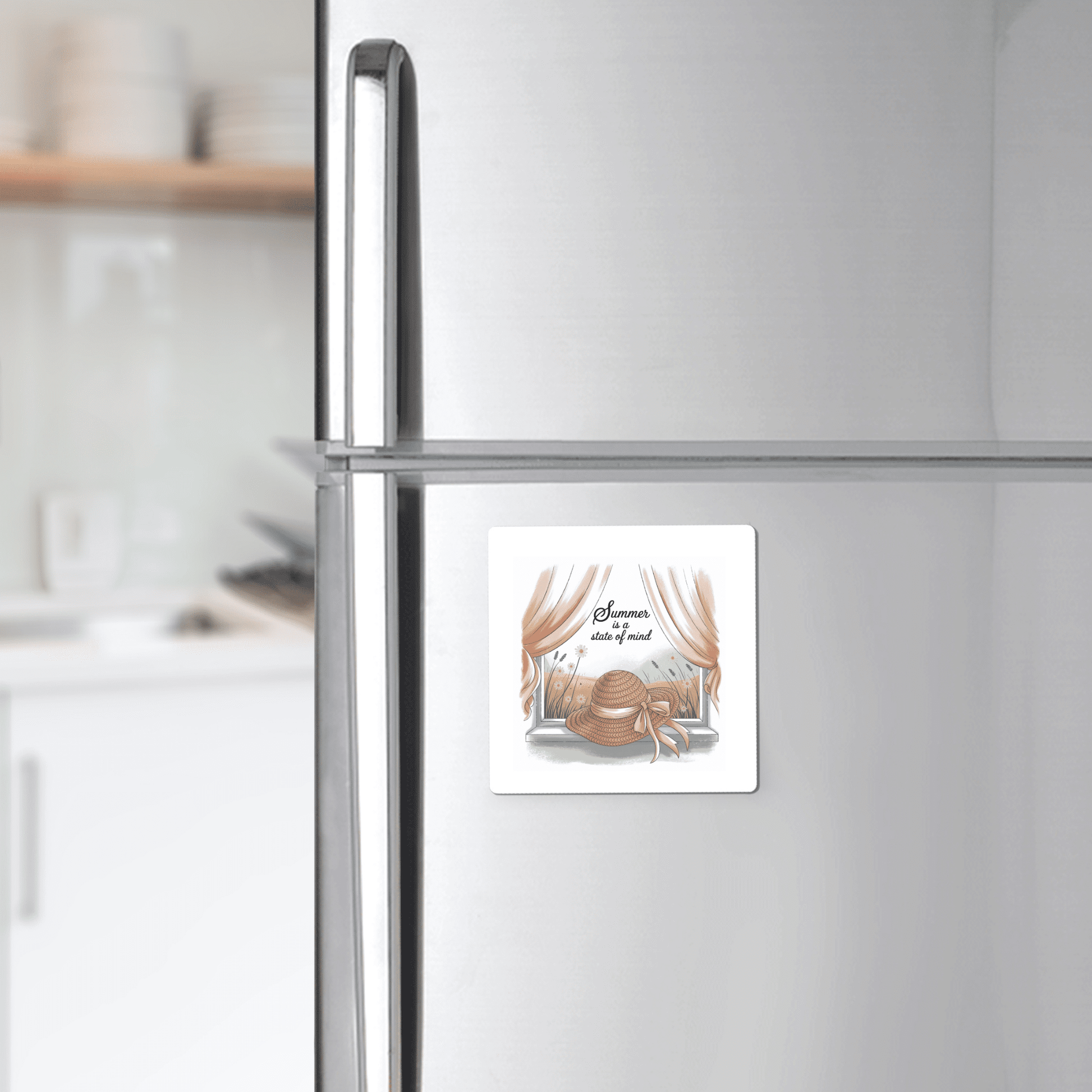 The Mirabilia Boutique "Summer Is a State of Mind Magnet – Soft Cottagecore Fridge Art" decorates a stainless steel fridge with a straw hat, ribbon, and greenery illustration beneath pink curtains in a modern kitchen.