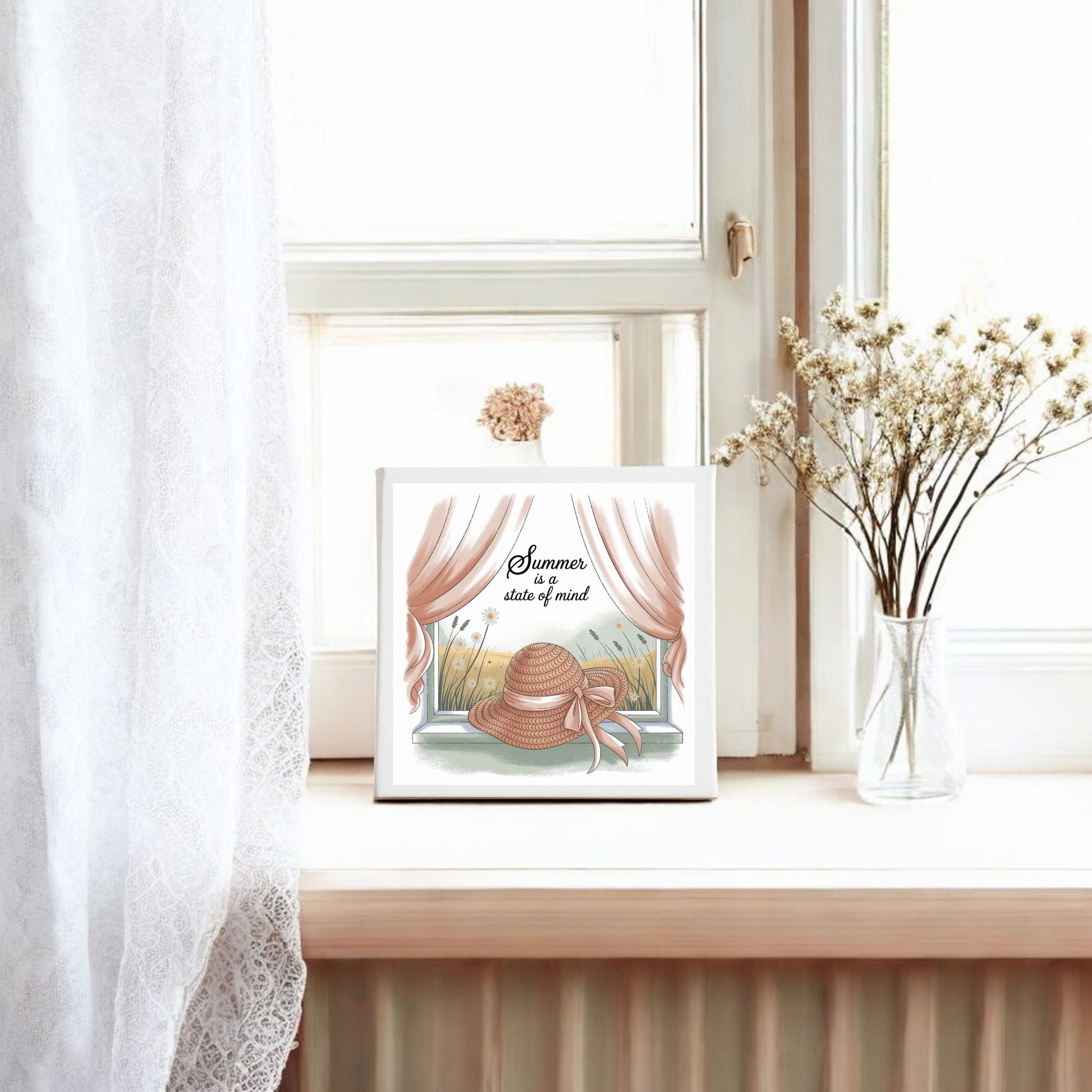 Bright cottagecore decor from Mirabilia Boutique: the "Summer Is a State of Mind Canvas" features a charming countryside scene with white curtains, dried flowers, and a straw hat, perfect for your cozy home.
