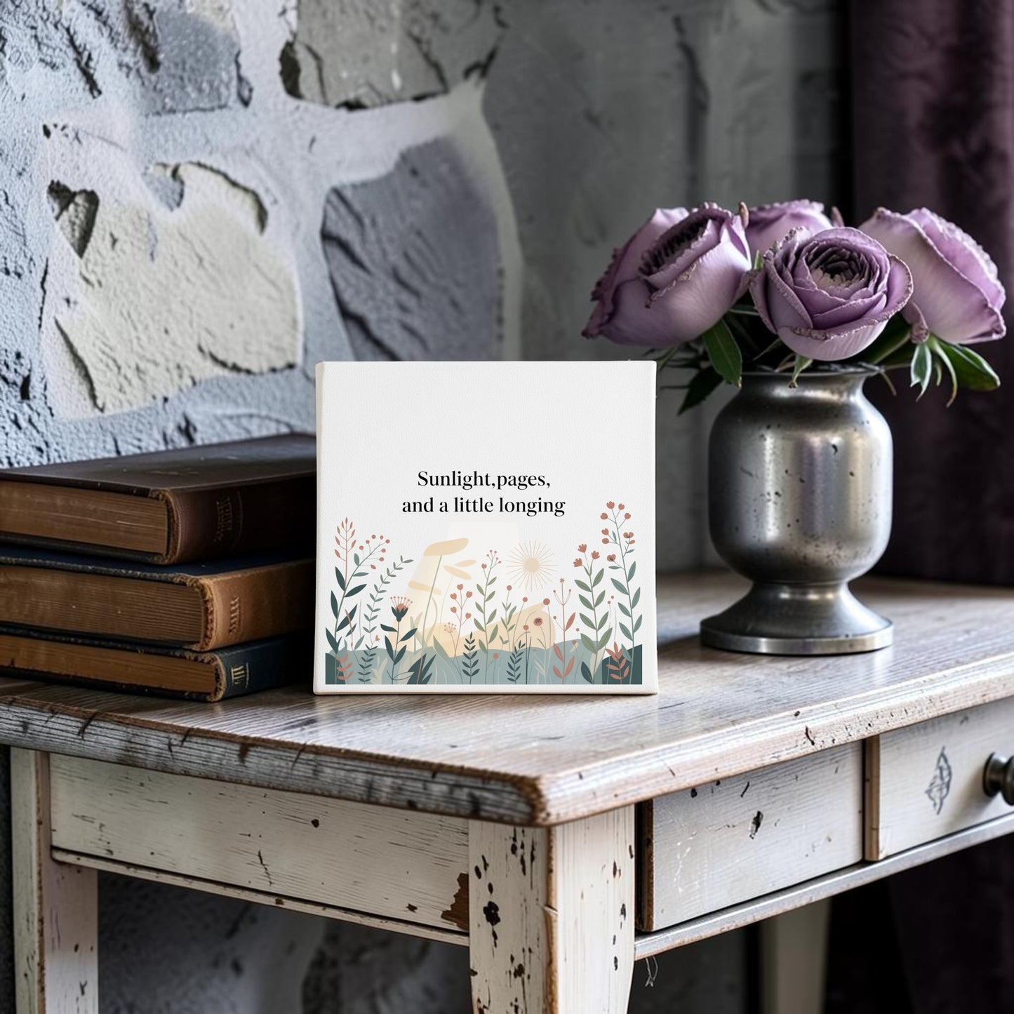 The Sunlight, Pages and a Little Longing Canvas by Mirabilia Boutique features botanical art and a literary theme, making it a perfect decor piece. Displayed on rustic wood with purple roses and old books, it adds charm to any home. Stone wall background included.