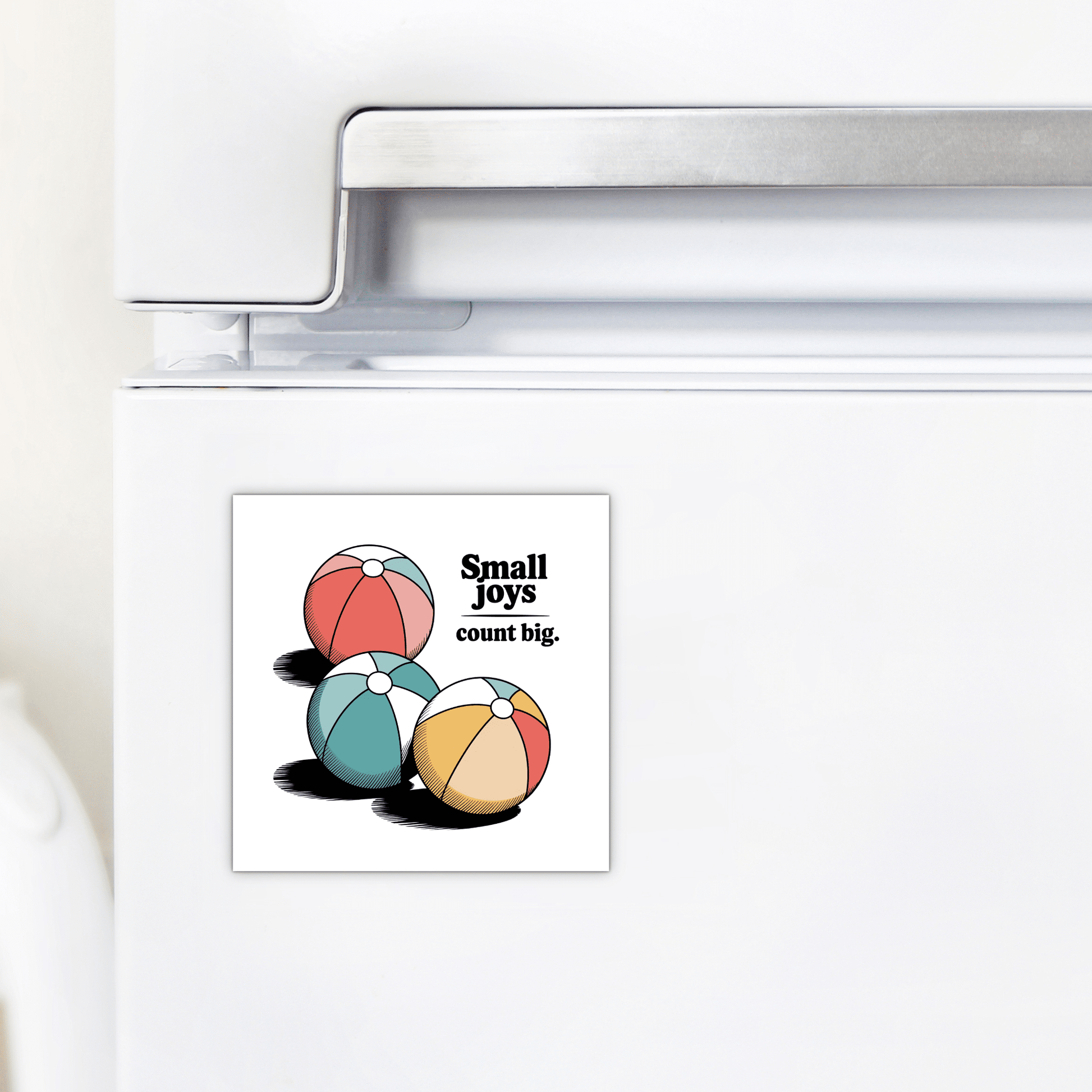 The Small Joys Count Big Magnet – Retro Summer Fridge Art by Mirabilia Boutique features three colorful beach balls and the phrase "Small joys count big." Perfect as cheerful summer decor or a motivational magnet for your kitchen.