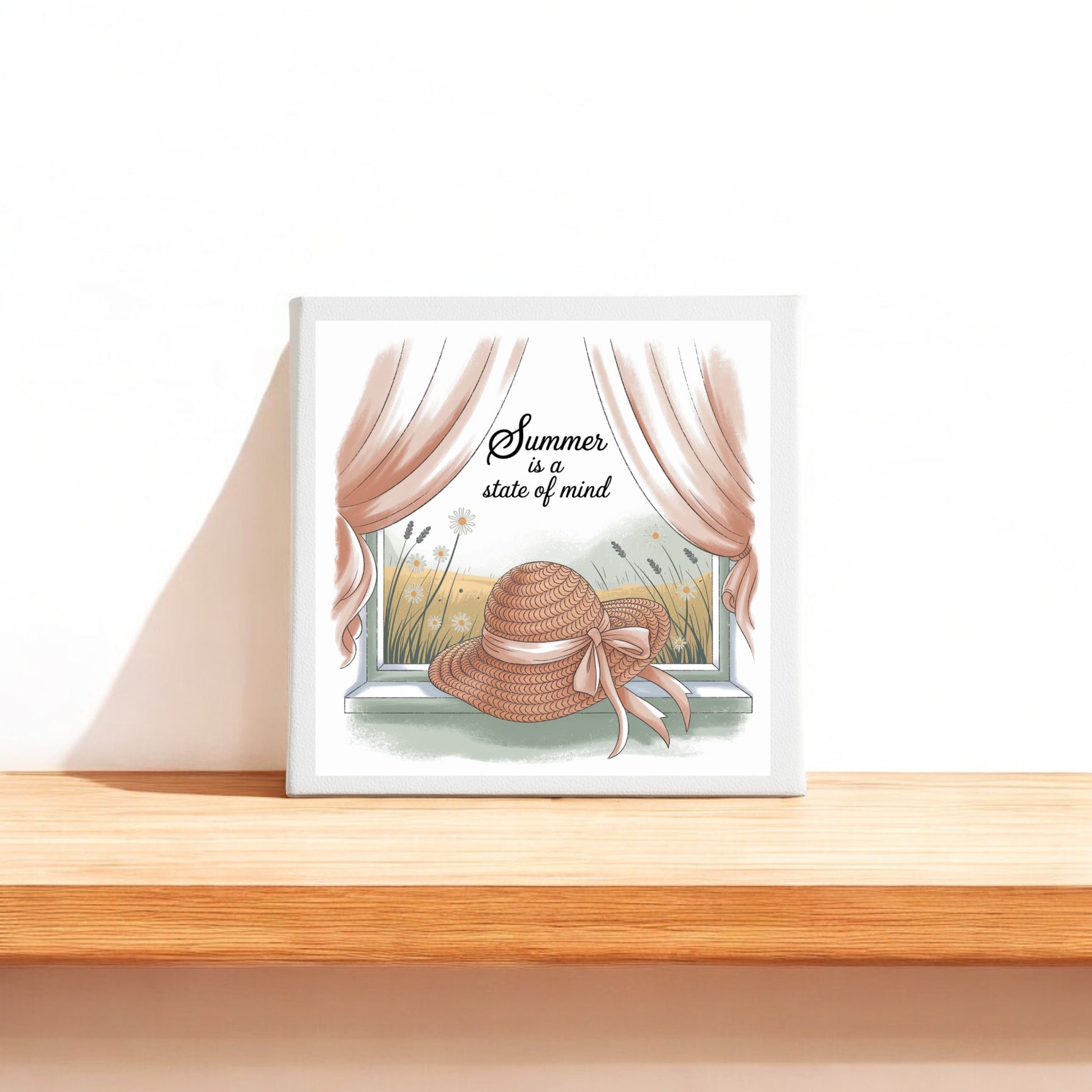 The "Summer Is a State of Mind Canvas – Soft Cottagecore Art" by Mirabilia Boutique features a straw hat on a windowsill, pink curtains, and wildflowers. This charming wall art brings cozy summer vibes to any space.