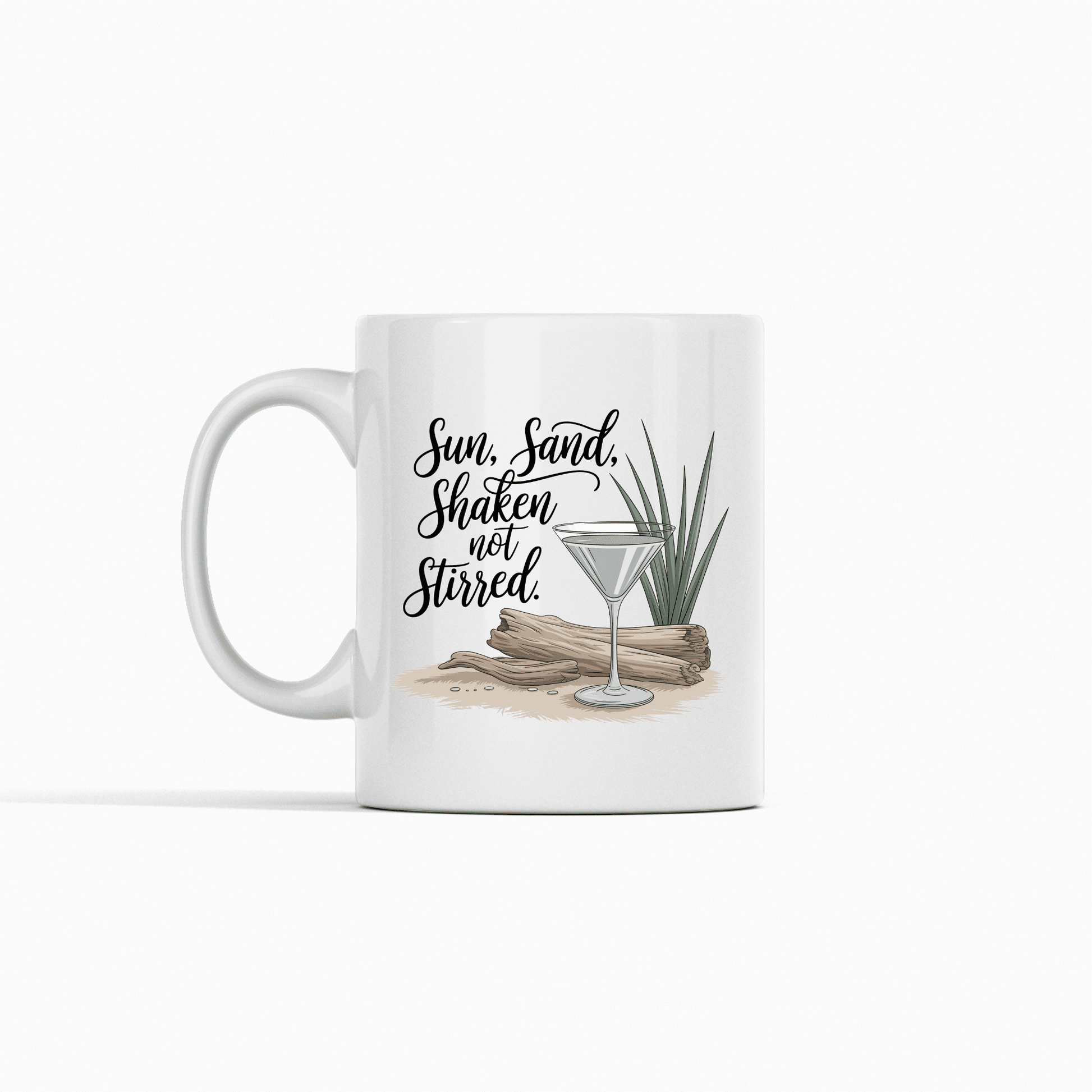 The Sun, Sand, Shaken Not Stirred Mug – Coastal Coffee Vibe by Mirabilia Boutique features driftwood, a green plant, sand, and a martini glass with the phrase “Sun, Sand, Shaken not Stirred.” Perfect for beach house decor. White background.