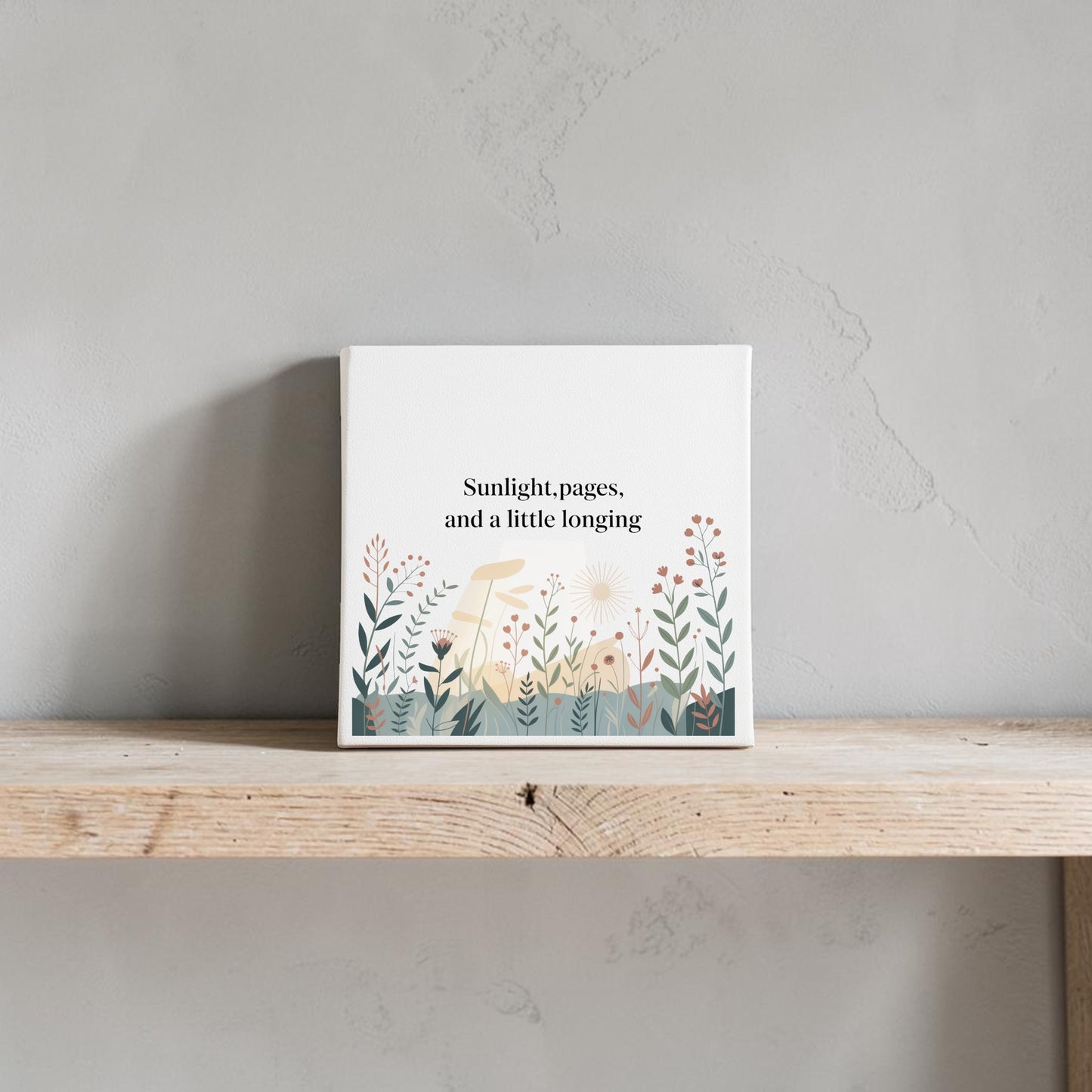 The Sunlight, Pages and a Little Longing Canvas by Mirabilia Boutique features botanical artwork, making it striking literary decor for your space. Displayed on a wooden shelf, it stands out beautifully against any plain wall.