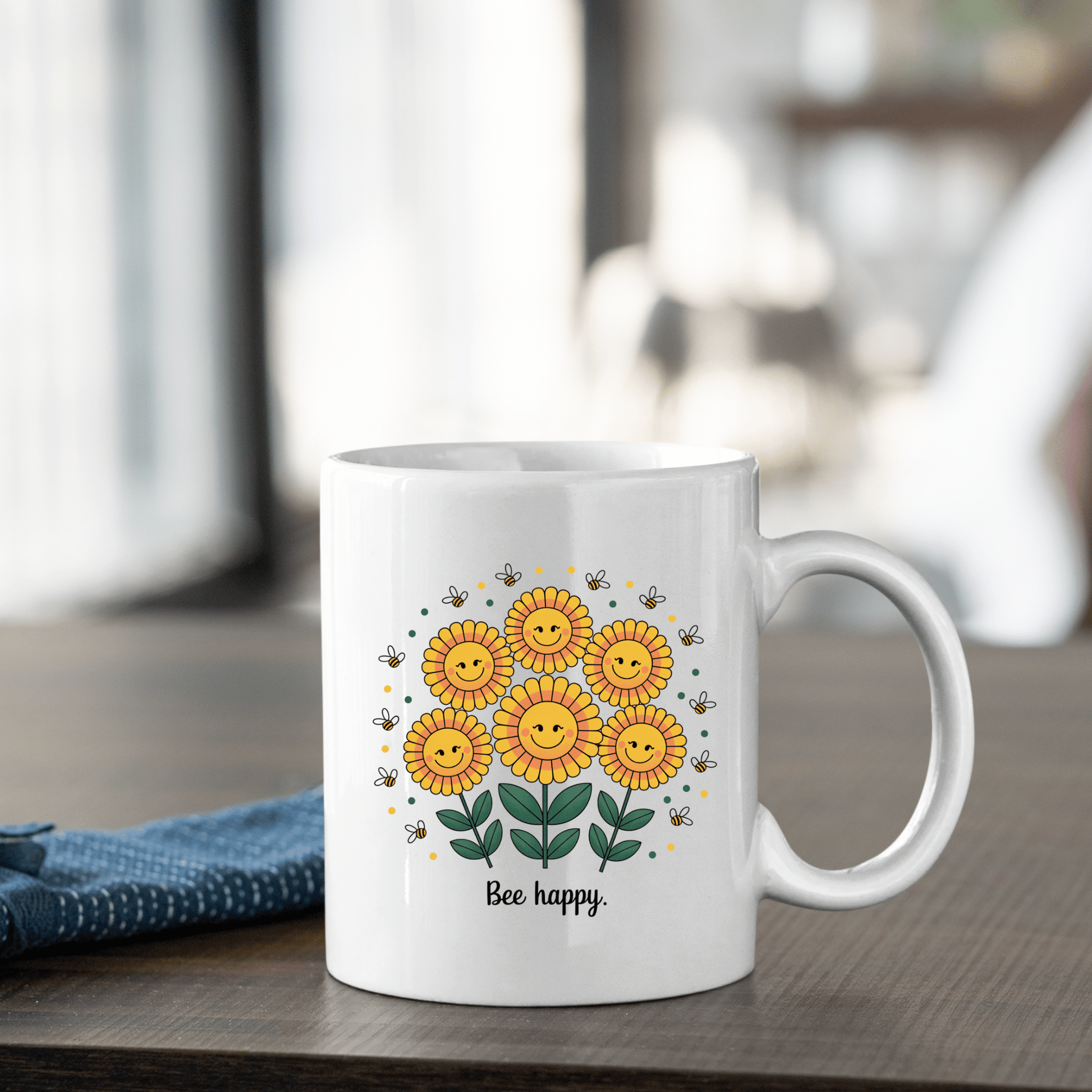 The Bee Happy Mug – Cheerful Sunflowers & Summer Joy by Mirabilia Boutique features smiling sunflowers, buzzing bees, and "Bee happy." text—making it a cheerful gift for any table setting.