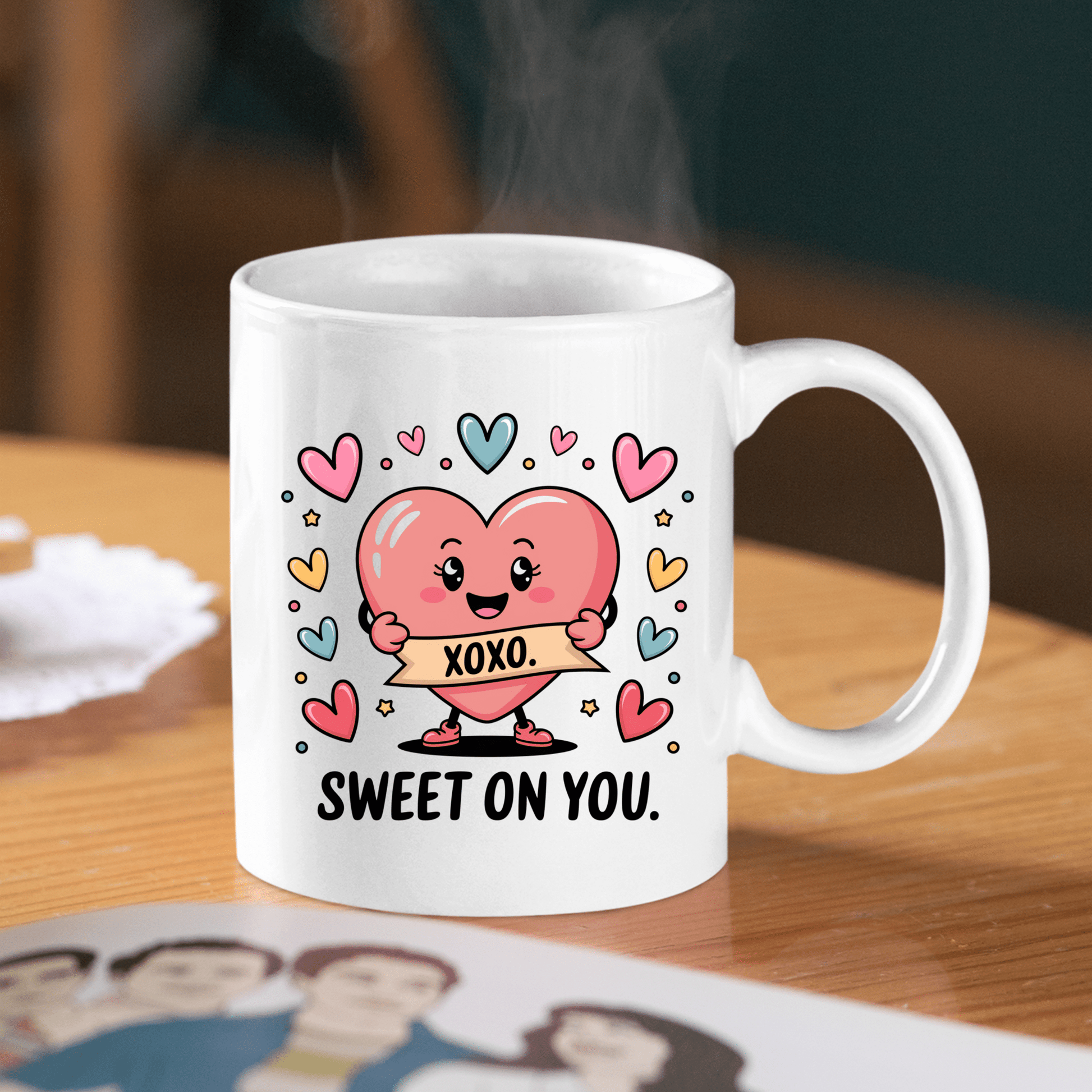The Sweet On You Heart Mug by Mirabilia Boutique features a cartoon heart with an "XOXO" banner, colorful hearts, and "SWEET ON YOU" text—making it the perfect cute Valentine's gift for someone special.