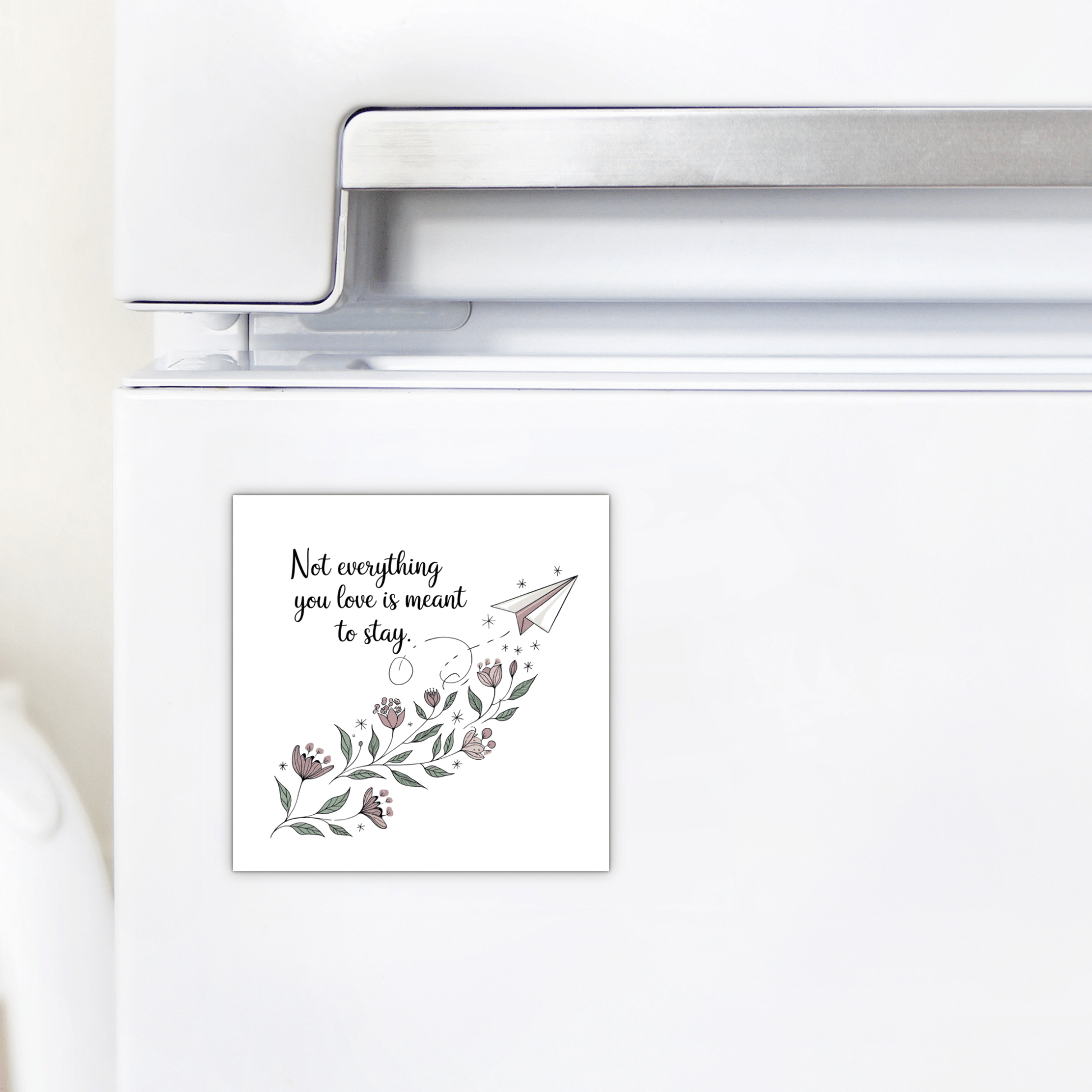 A white fridge with Mirabilia Boutique’s Grief Quote Magnet—featuring floral art, a paper airplane, and “Not Everything You Love Is Meant to Stay”—adds a heartfelt touch to decor or makes a thoughtful sympathy gift.