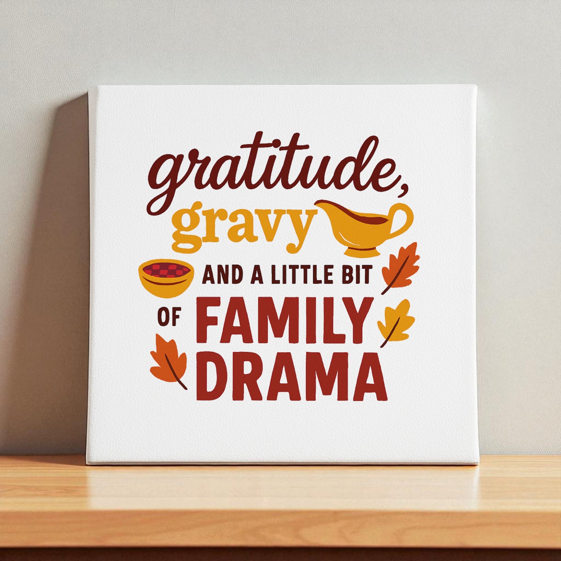 The Mirabilia Boutique "Gratitude Gravy & Family Drama" 8x8 canvas features the phrase with cute gravy, bowl, and autumn leaf illustrations—perfect as a funny Thanksgiving quote or family gathering gift.